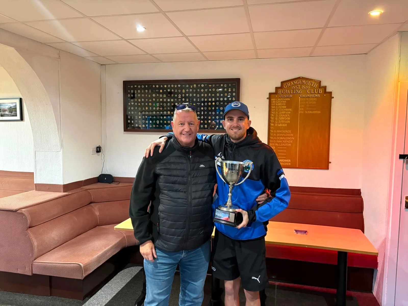 Proud Polmaise President Davie Stewart congratulates Aaron Furzer following his East & West Champion of Champions victory.