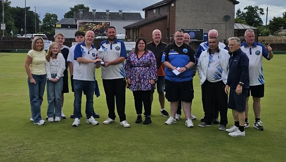 Charlie's daughters, Stacy and Charlene, accompanied by members of the family, proudly present the Memorial Trophy to winners Thomas Stevenson and Lewis Lyle. They are joined by runners-up Danny McCormick and William Neil, along with beaten semi-finalists Alex Brown / Sonia Donaldson, and Alex Reynolds / William Maxwell.