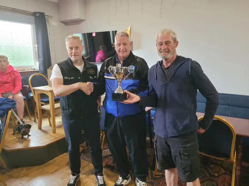 John Binnie's sons present the memorial trophy at the Polmaise and Spittalmyre friendly match