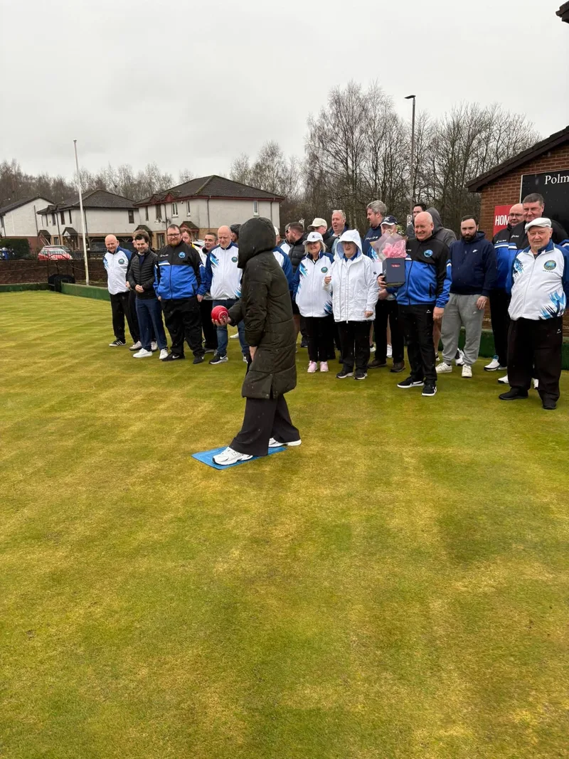Mrs Stewart throwing the first bowl of the 2026 season at Polmaise Bowling Club