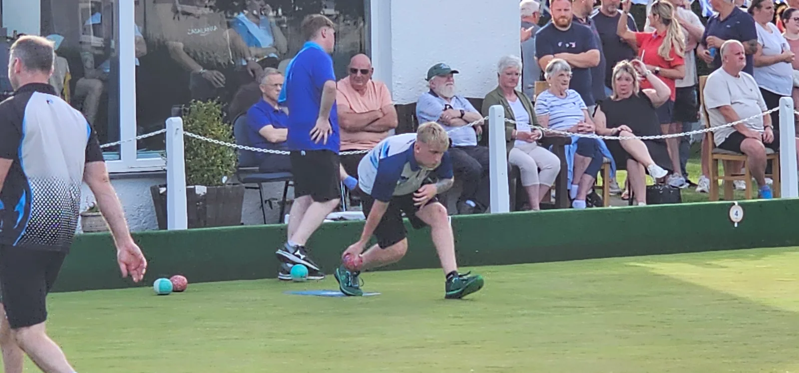 James Craig in action, delivering a crucial bowl during his victorious Junior Singles match against Clackmannan