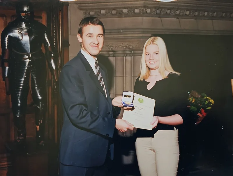 Claire Deans receiving an award